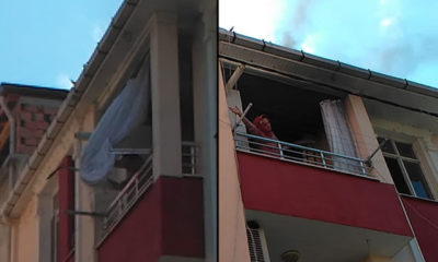 Sinir krizi geçiren kadın evini ateşe verip, eşyalarını balkondan attı