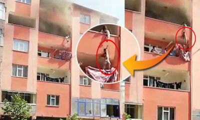 Yangında çocuklarını alt kattaki komşusunun balkonuna sarkıtarak kurtardı