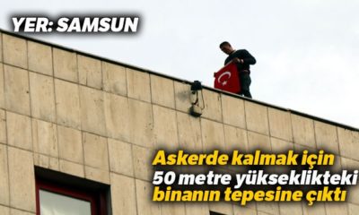 Askerde kalmak için binanın tepesine çıktı!.
