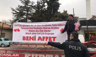 Ayrı yaşadığı eşi ile barışmak için pankart yaptırıp işyerine giden adamı eşi polise şikayet etti!.